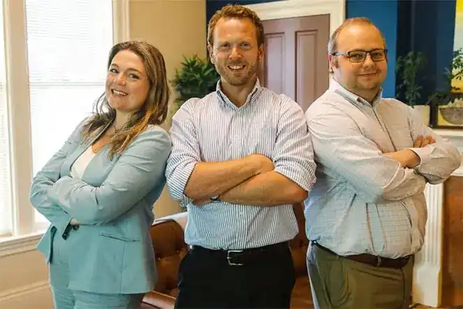 Three NW Legacy Law attorneys in the firm's office