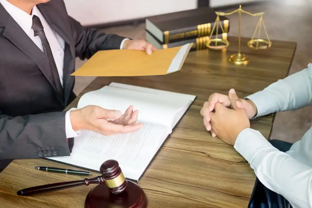 probate attorney reviewing estate settlement documents with a Camas, WA client